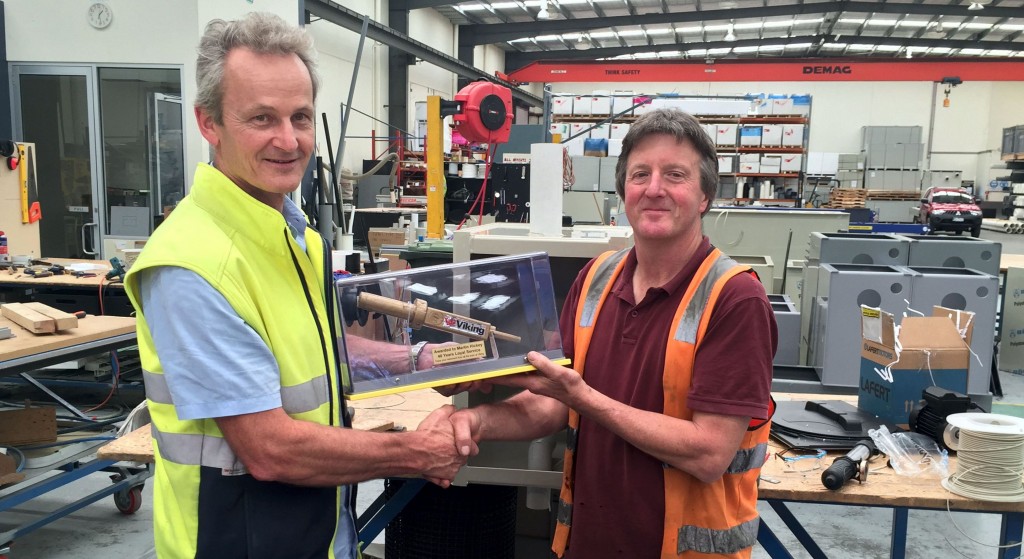 L-R: Viking Plastics Managing Director, Malcolm Ling, presenting longtime employee, Martin Hickey, with a "gold" welding gun